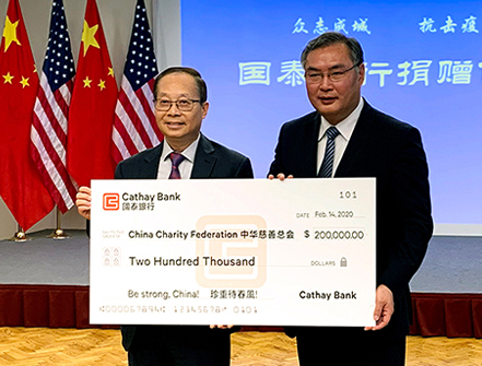 Pin Tai (left), Chief Executive Officer of Cathay Bank, presented donation check to Zhang Ping (right), the Consul General of the Consulate General of the People's Republic of China in Los Angeles, in support of the coronavirus control efforts in China.
